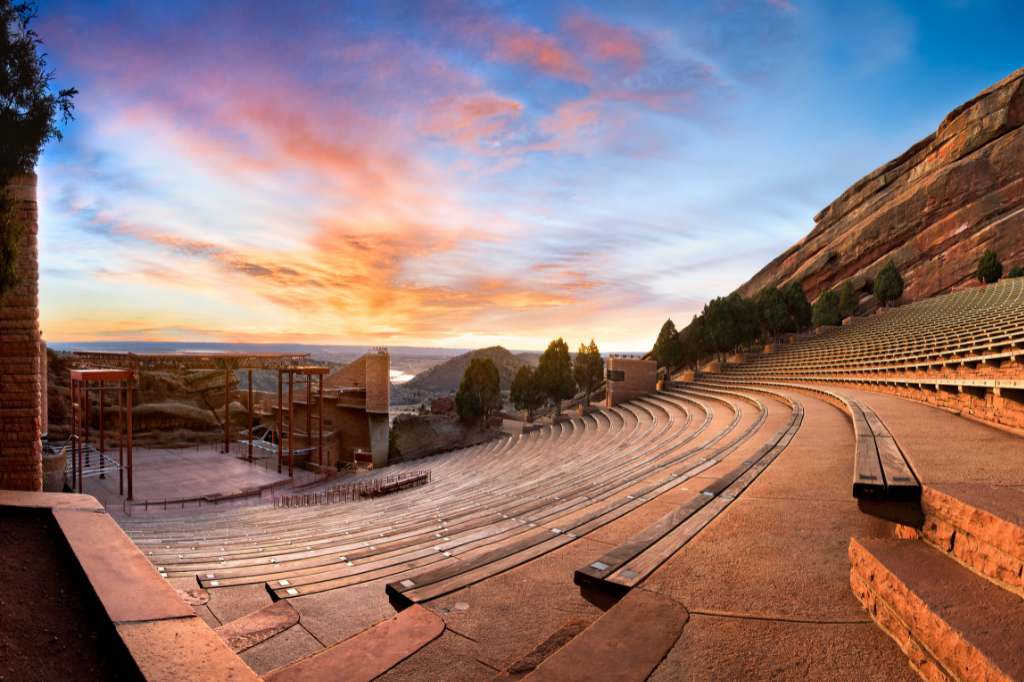 Things to do in Denver, photo of empty red rocks amphitheater with sunset